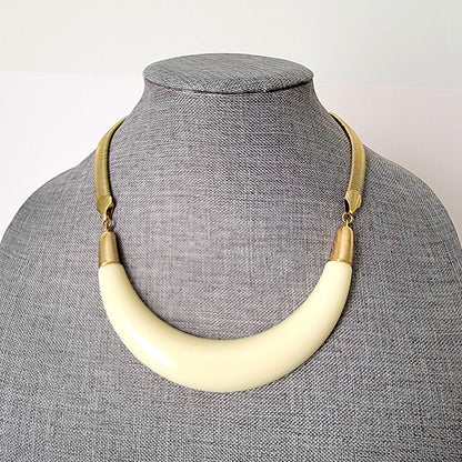 Cream curved acrylic statement necklace.