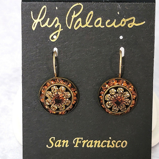 Orange crystal earrings on card by Liz Palacios.