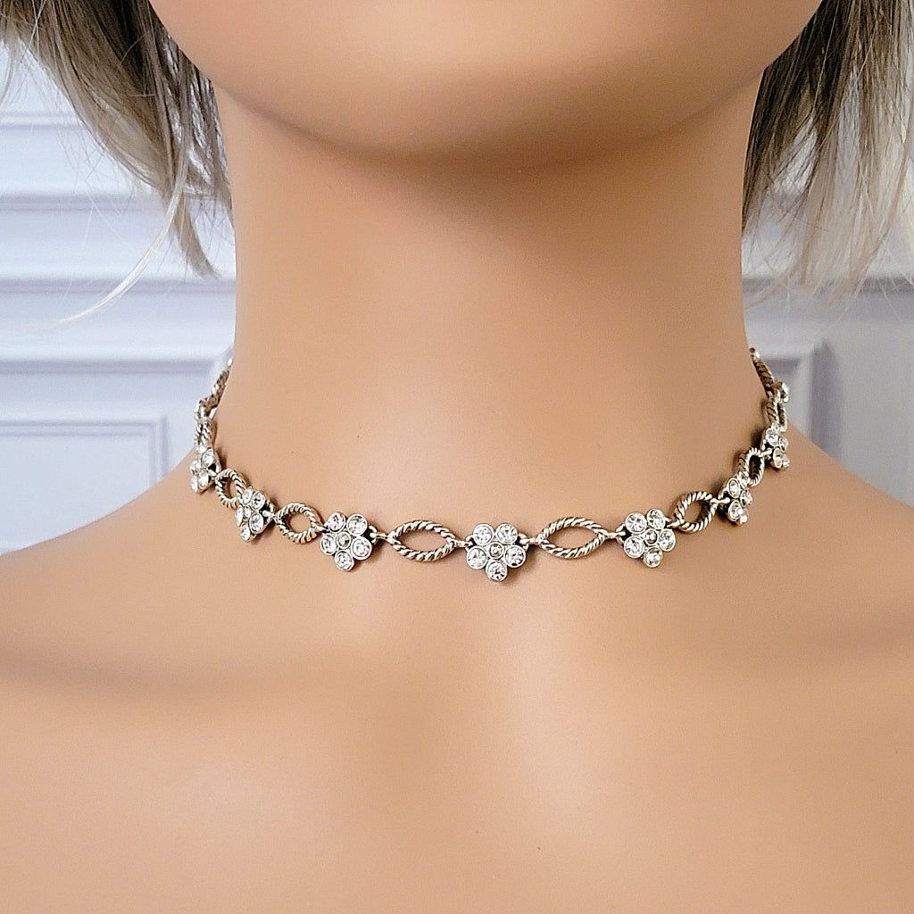 Rhinestone flower choker necklace on a mannequin.