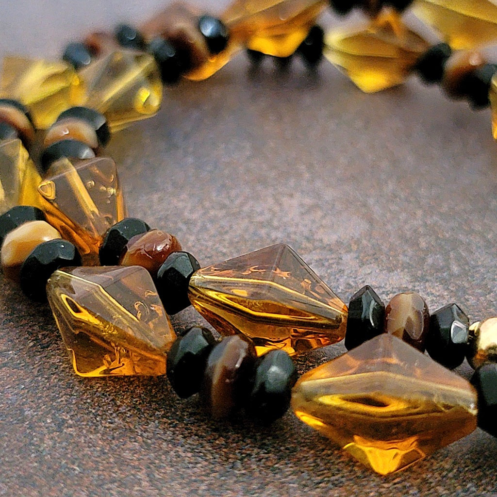 Amber orange and black glass beads.