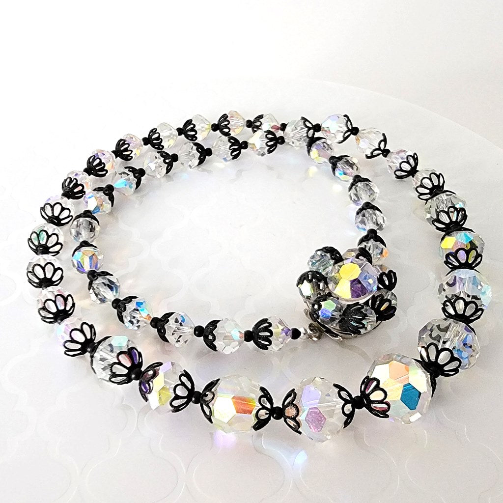 Aurora borealis glass beaded necklace with black bead caps.