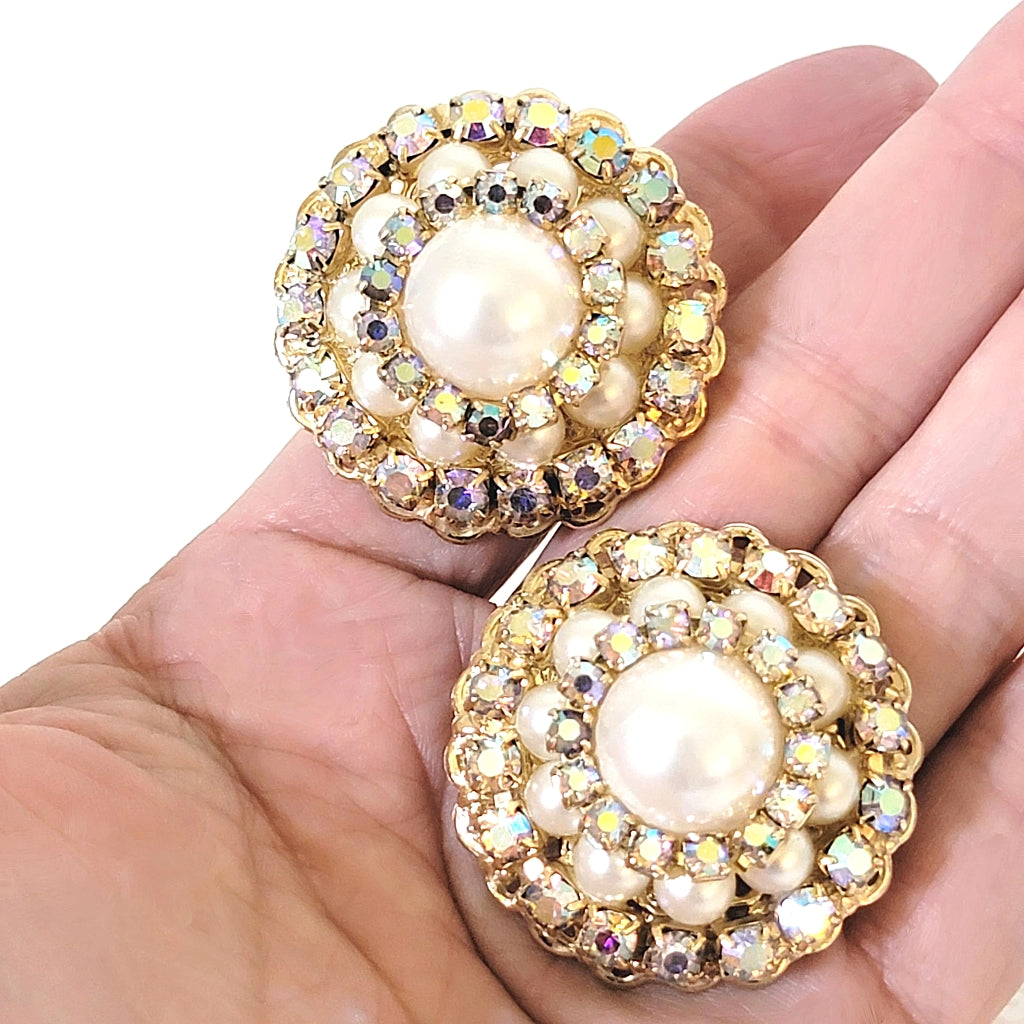 Large vintage rhinestone dome earrings in hand.