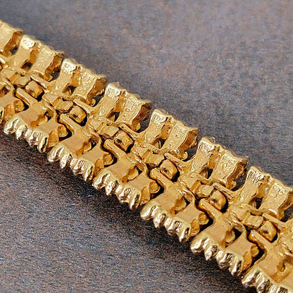 Back side of a gold tone vintage link bracelet.