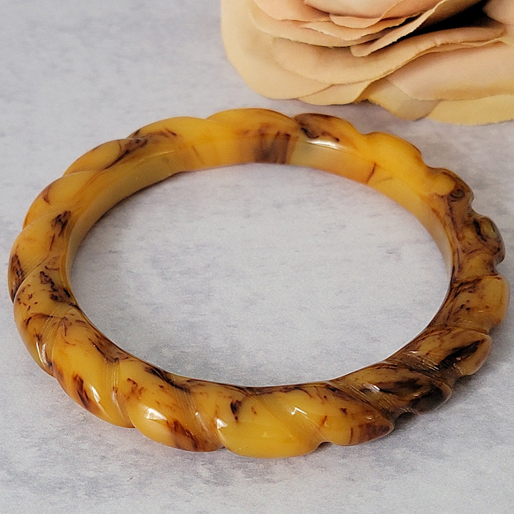 Yellow brown swirled bakelite bangle bracelet.