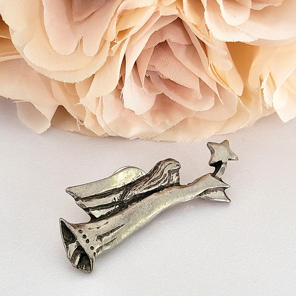 Folk art style pewter angel pin.