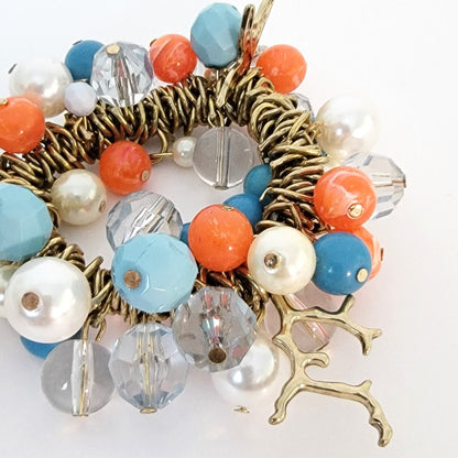 Bead dangle stretch bracelet, orange and blue.