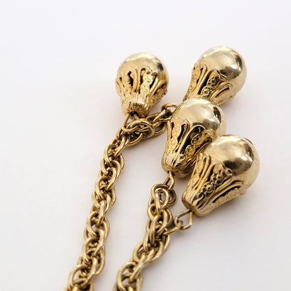Gold tone dangle beads.