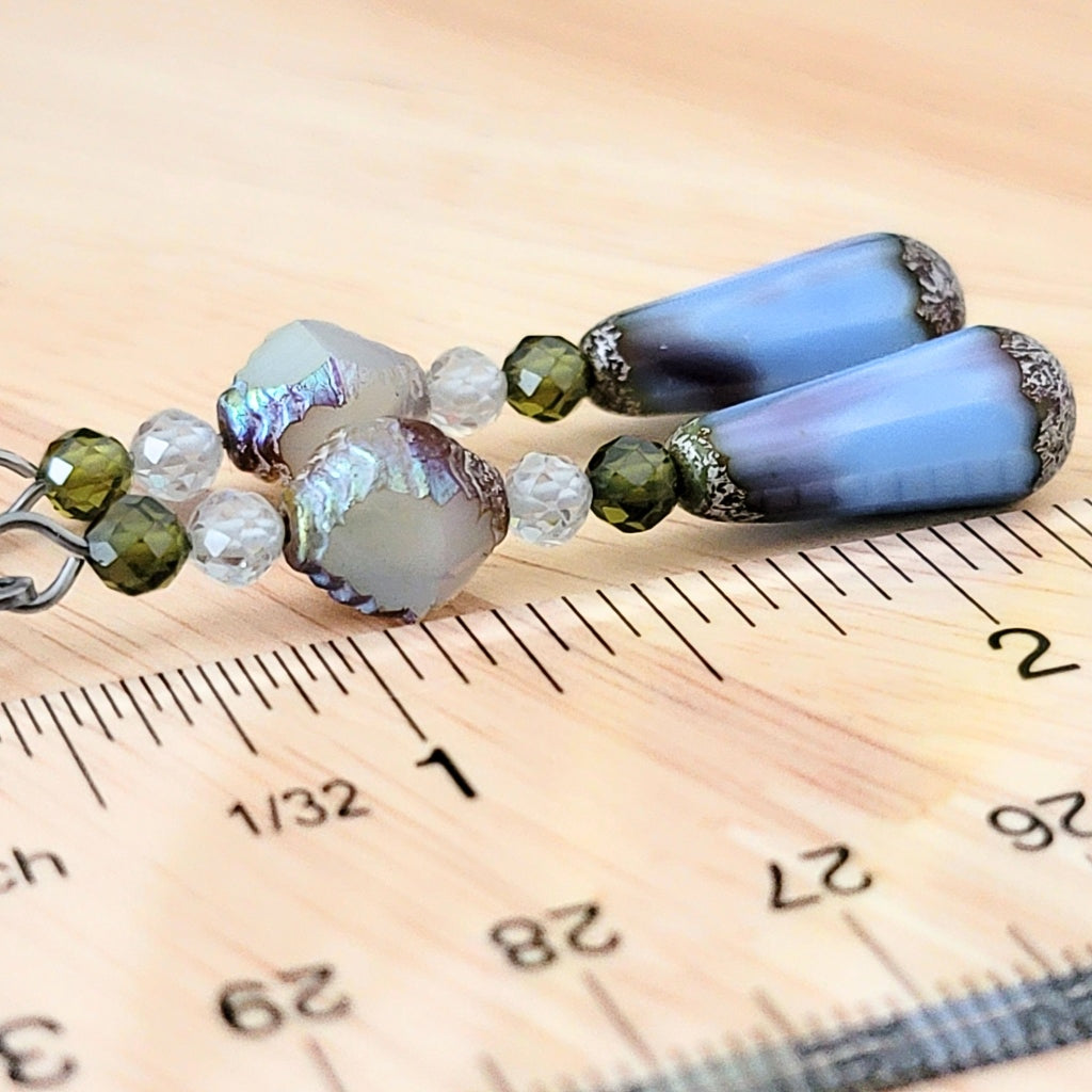 Blue and white glass beads with ruler.