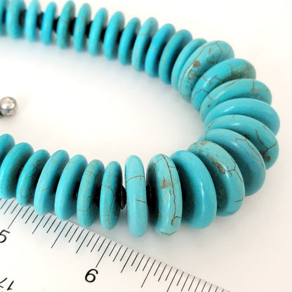 Faux turquoise beads with ruler.