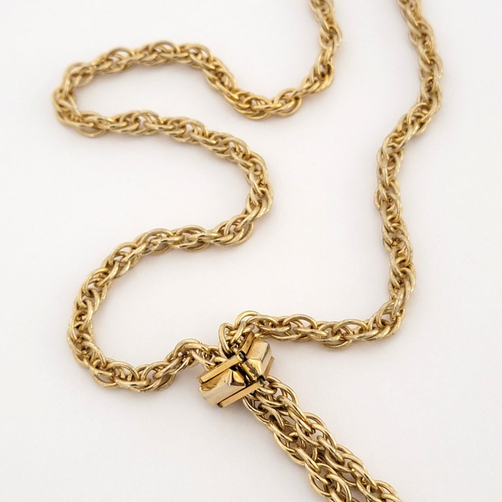 Gold tone rope chain.