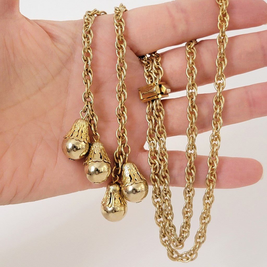 Vintage gold tone chain in hand.