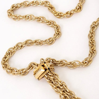 Gold tone rope chain with slider.