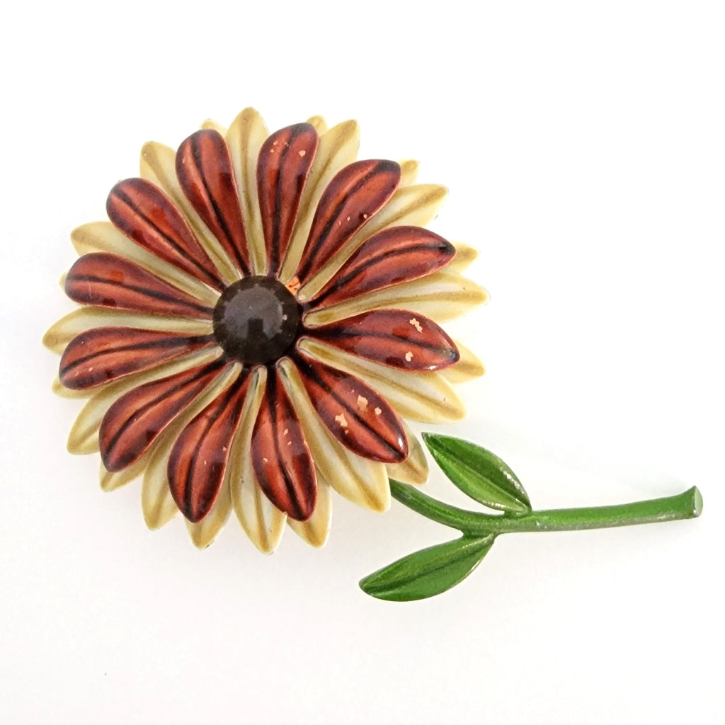 Big brown and cream enamel flower pin with long stem.