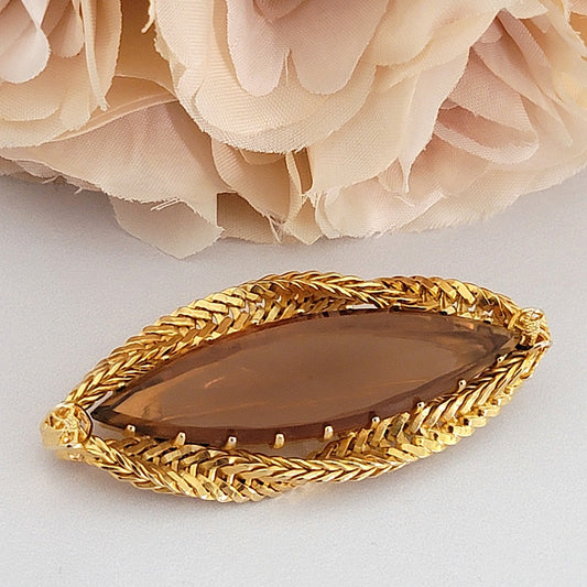 Brown glass brooch.