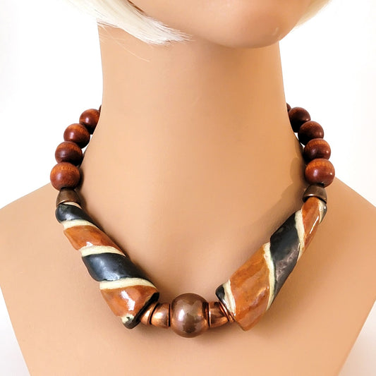 Chunky ceramic and wood beaded choker on mannequin.