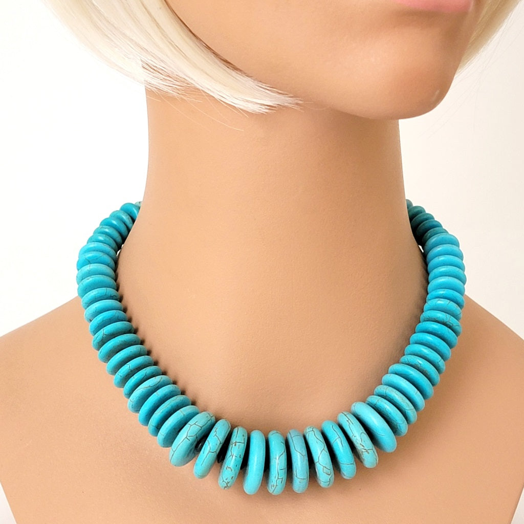 Faux turquoise choker on mannequin.