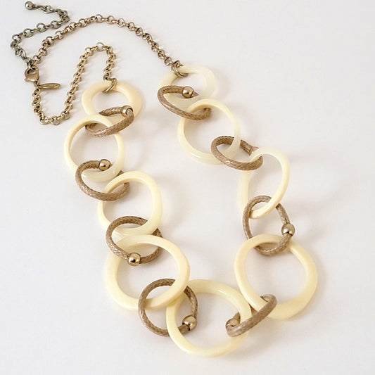 Long Chicos necklace with large cream acrylic links.