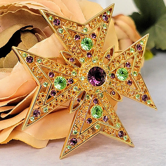 Large Maltese cross brooch with rhinestones.