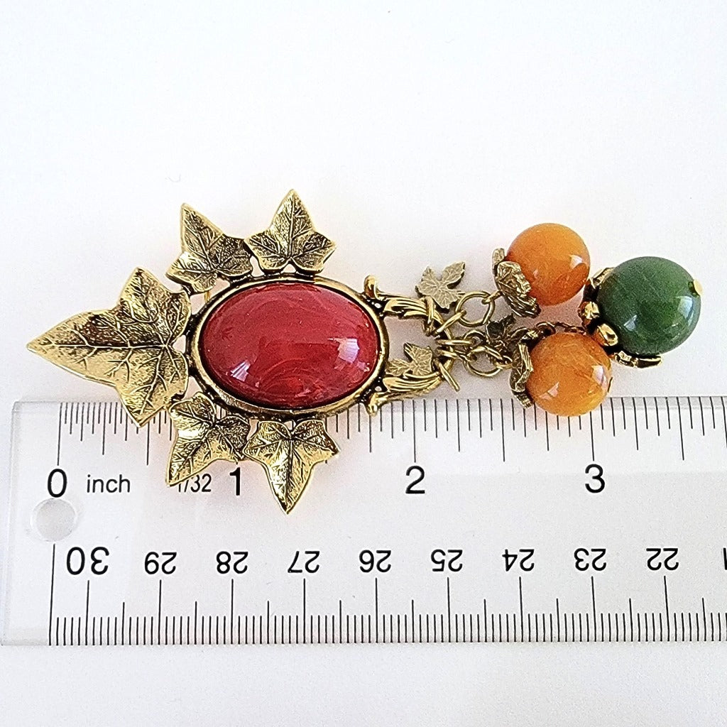 Leaf dangle brooch with ruler.