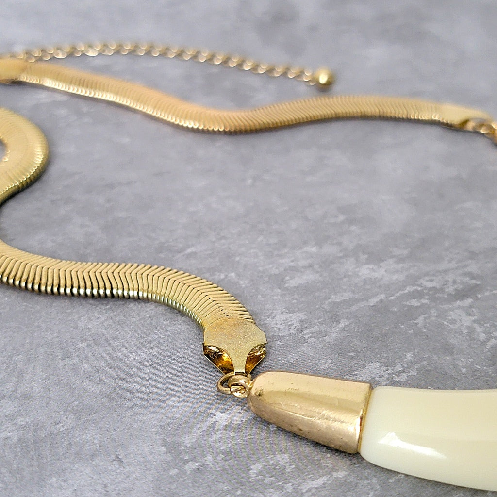 Necklace connector on snake chain.