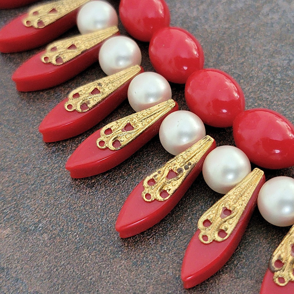 Bead detail on a vintage red necklace.