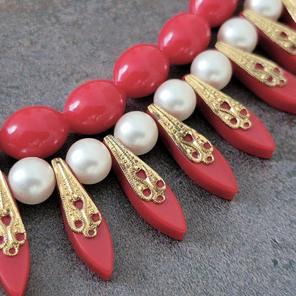 Detail of beads on a vintage red necklace.