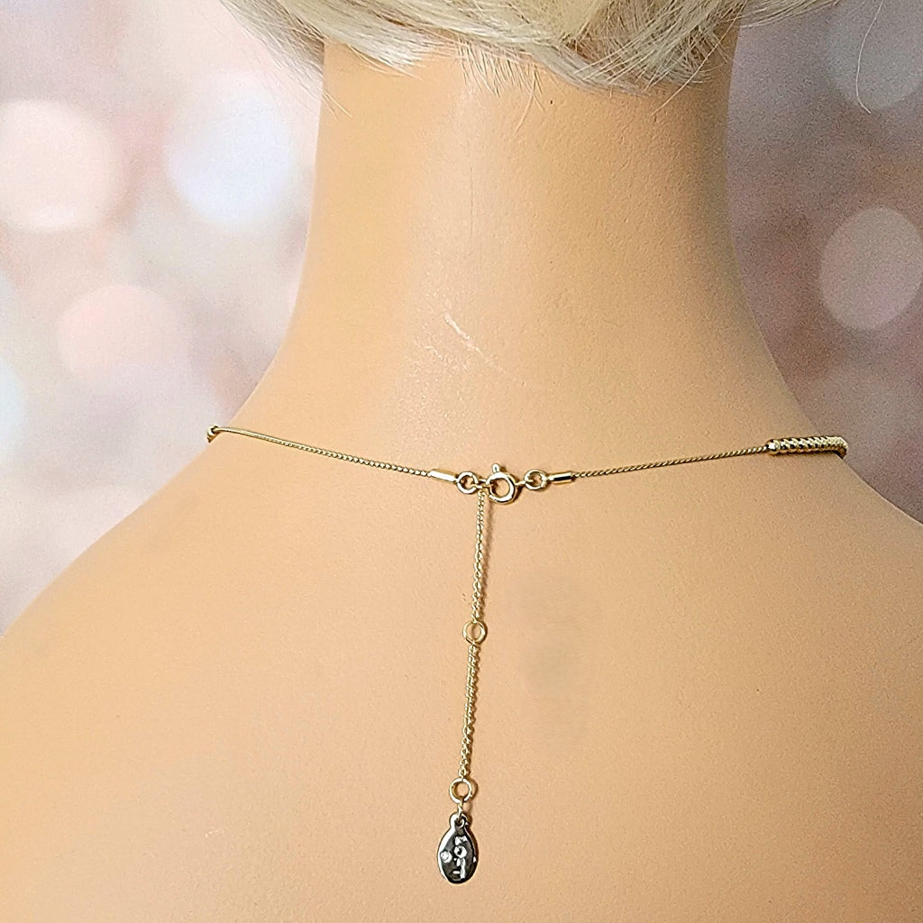 Necklace extender chain on a mannequin.