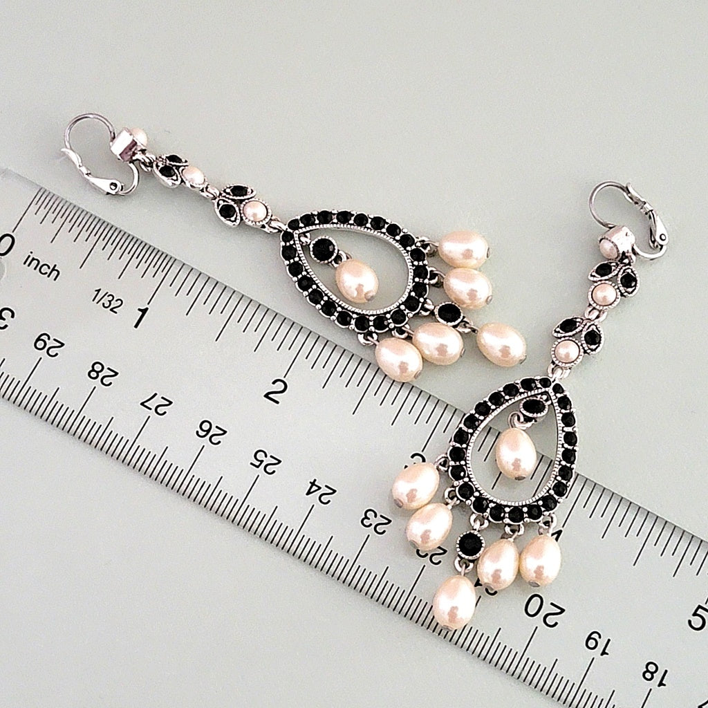 Long faux pearl earrings with ruler.