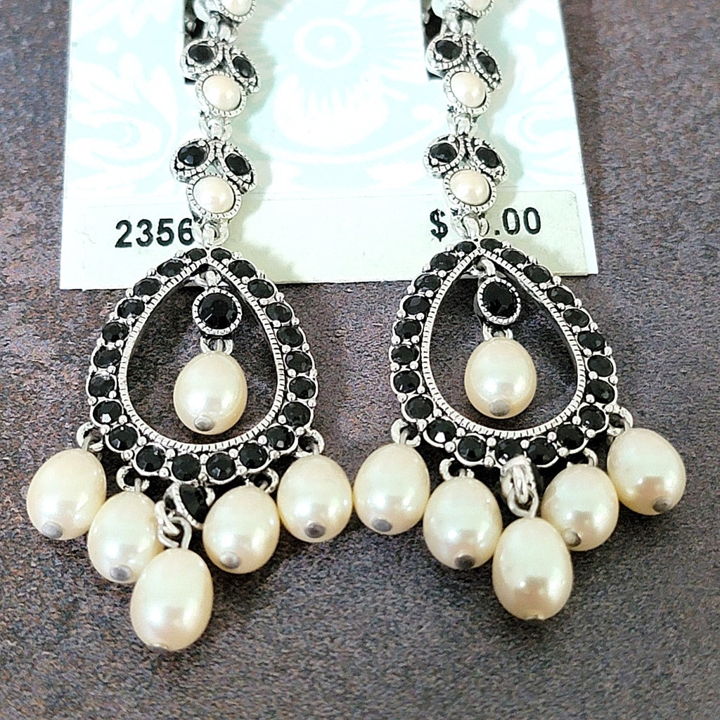 Faux pearl dangle beads on earrings.