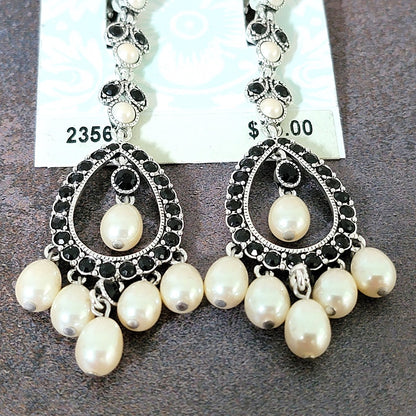 Faux pearl dangle beads on earrings.