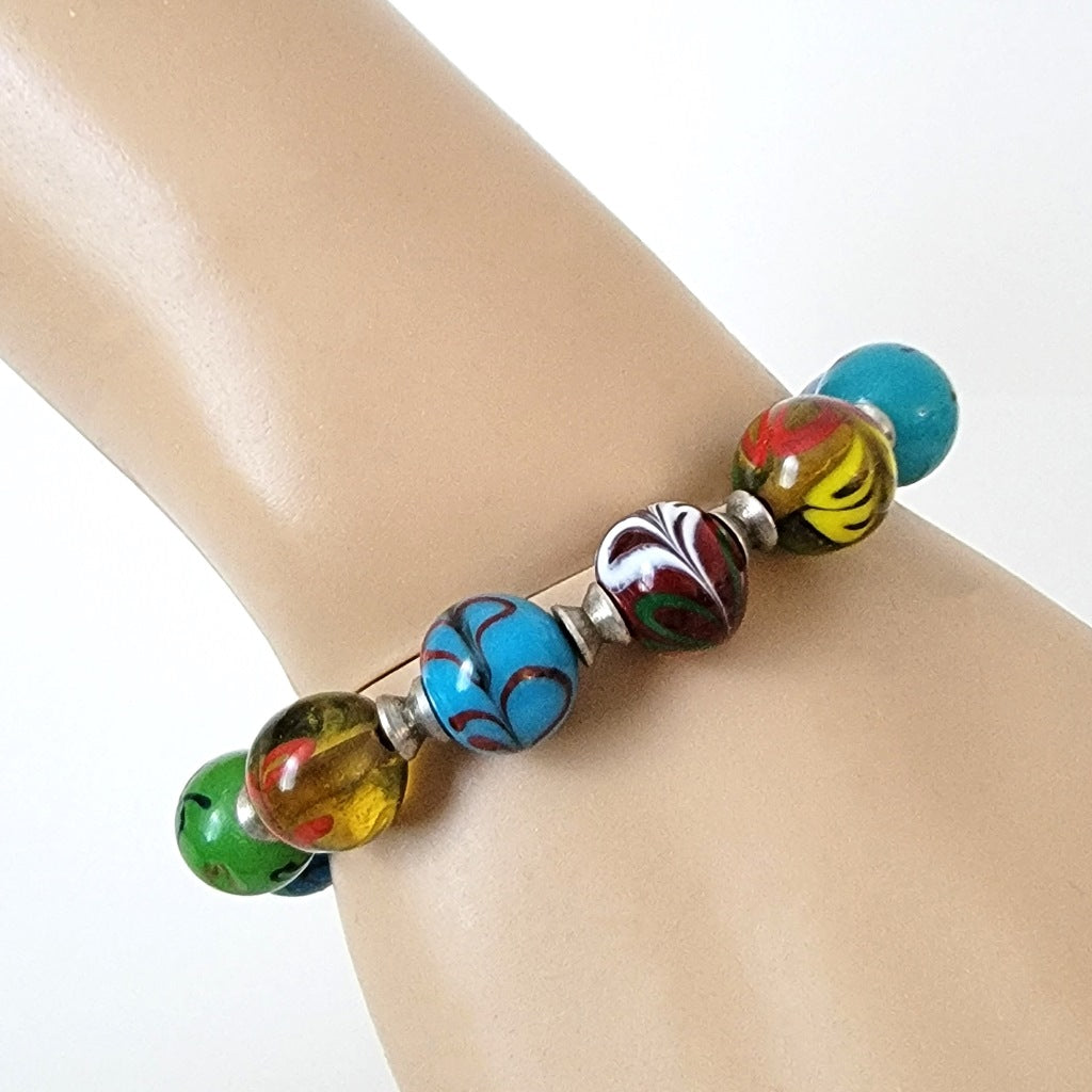 Glass bead bracelet on wrist.