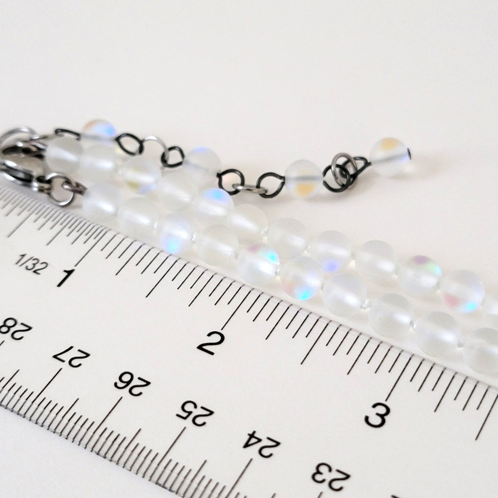 Frosted glass beads with ruler.