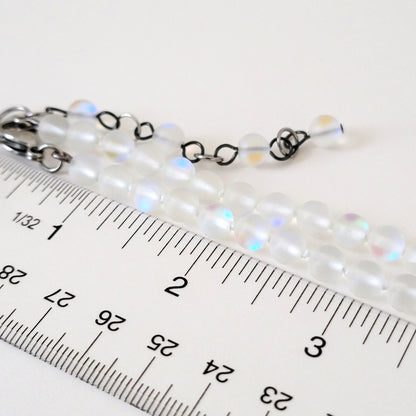 Frosted glass beads with ruler.