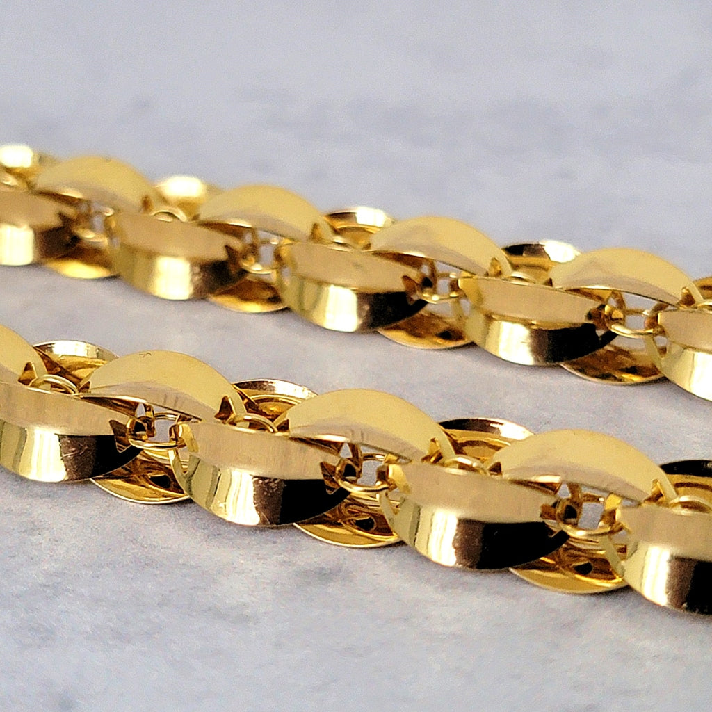 Gold plated bronze necklace links.