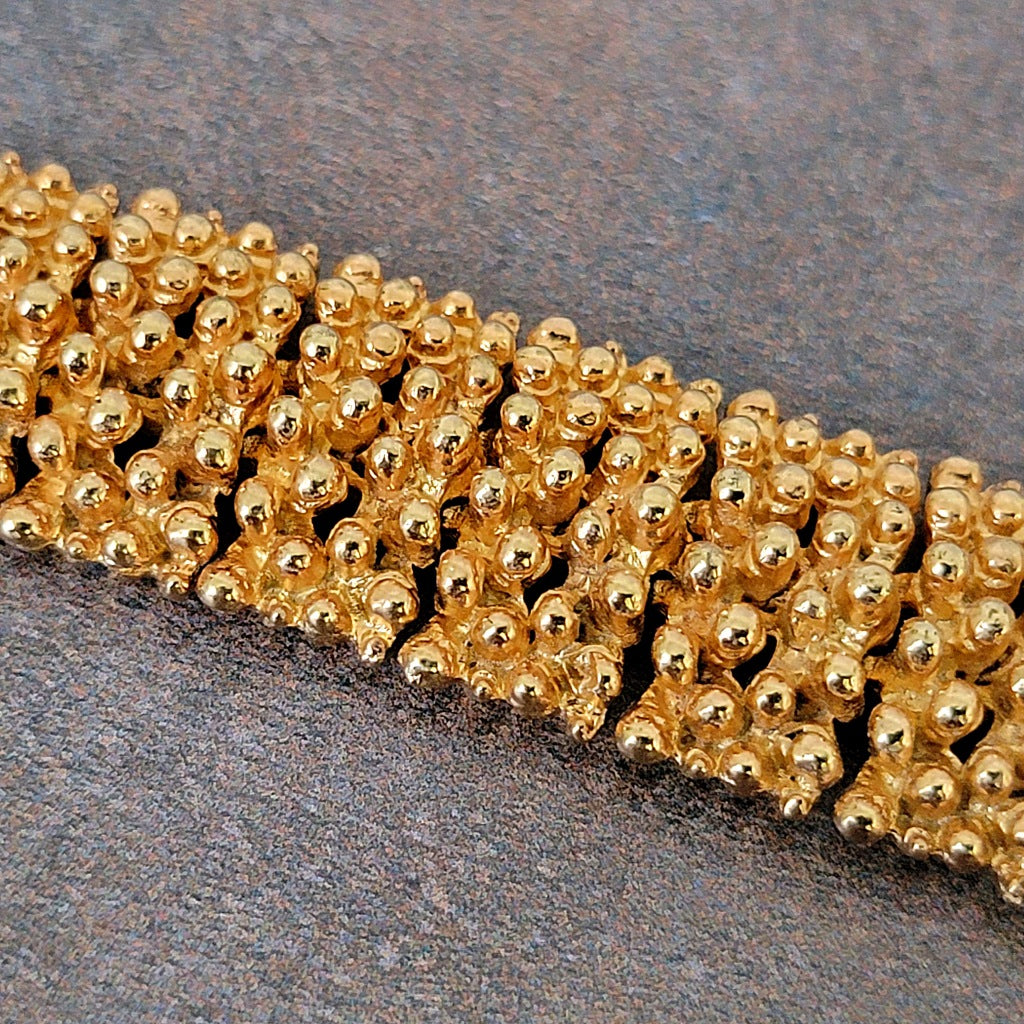 Knobby textured gold tone bracelet links.