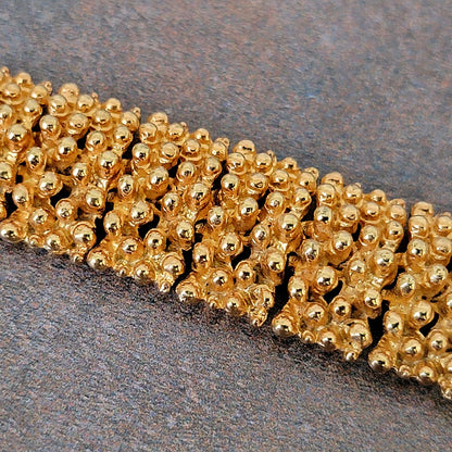 Knobby textured gold tone bracelet links.