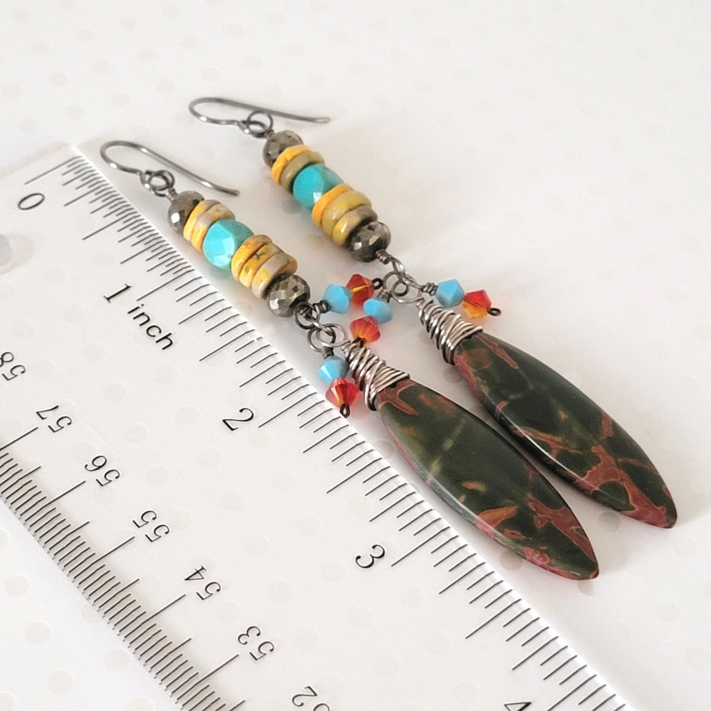 Long jasper dangle earrings, shown next to a ruler.