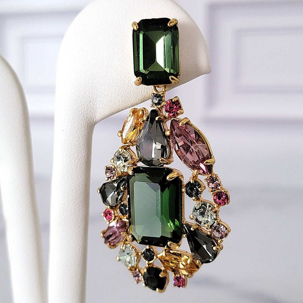 Big green rhinestone earring.