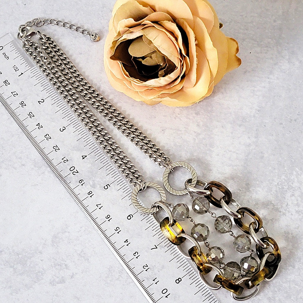 Loft tortoise chain necklace with a ruler.