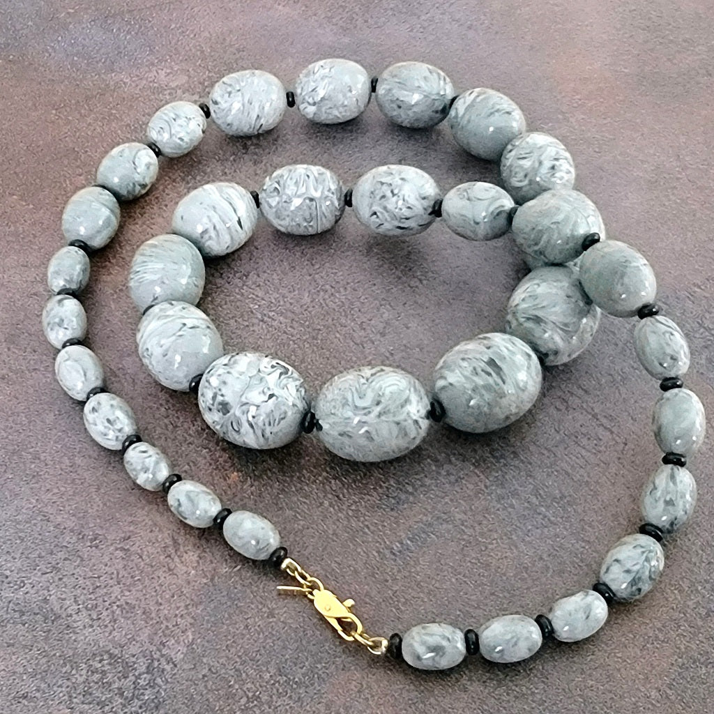 Monet long gray acrylic bead necklace.