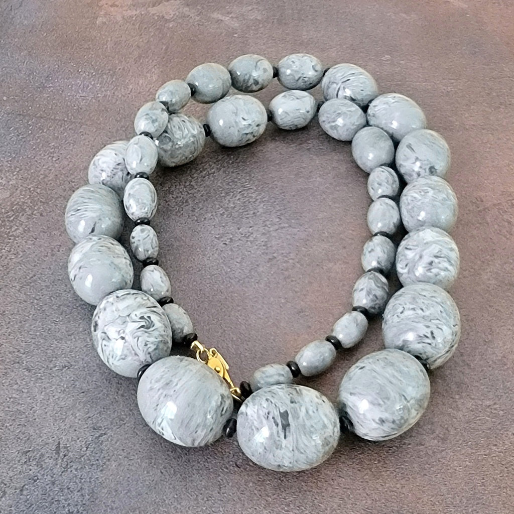 Big chunky gray acrylic beaded necklace.