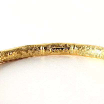 Monet signature mark inside of a bracelet.