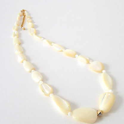 Long mother of pearl shell beaded necklace.