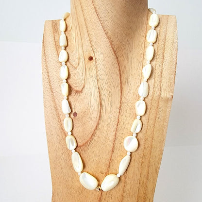 Mother of pearl necklace on stand.