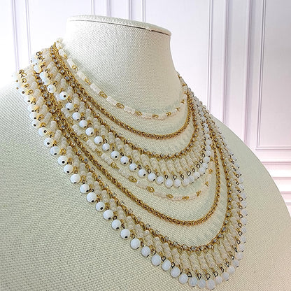 White bead dangle necklace.