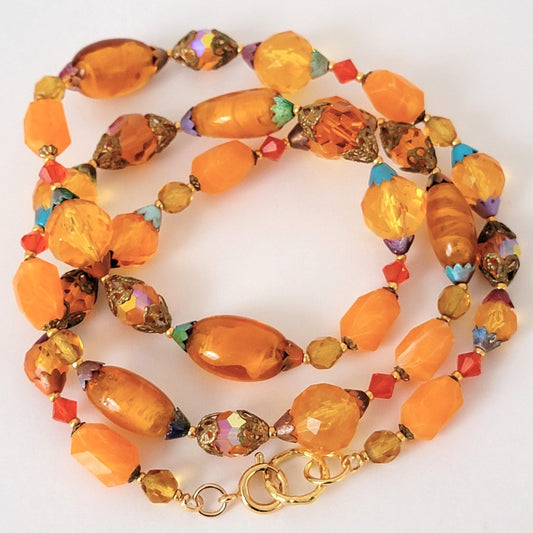 Orange beaded glass and lucite necklace.