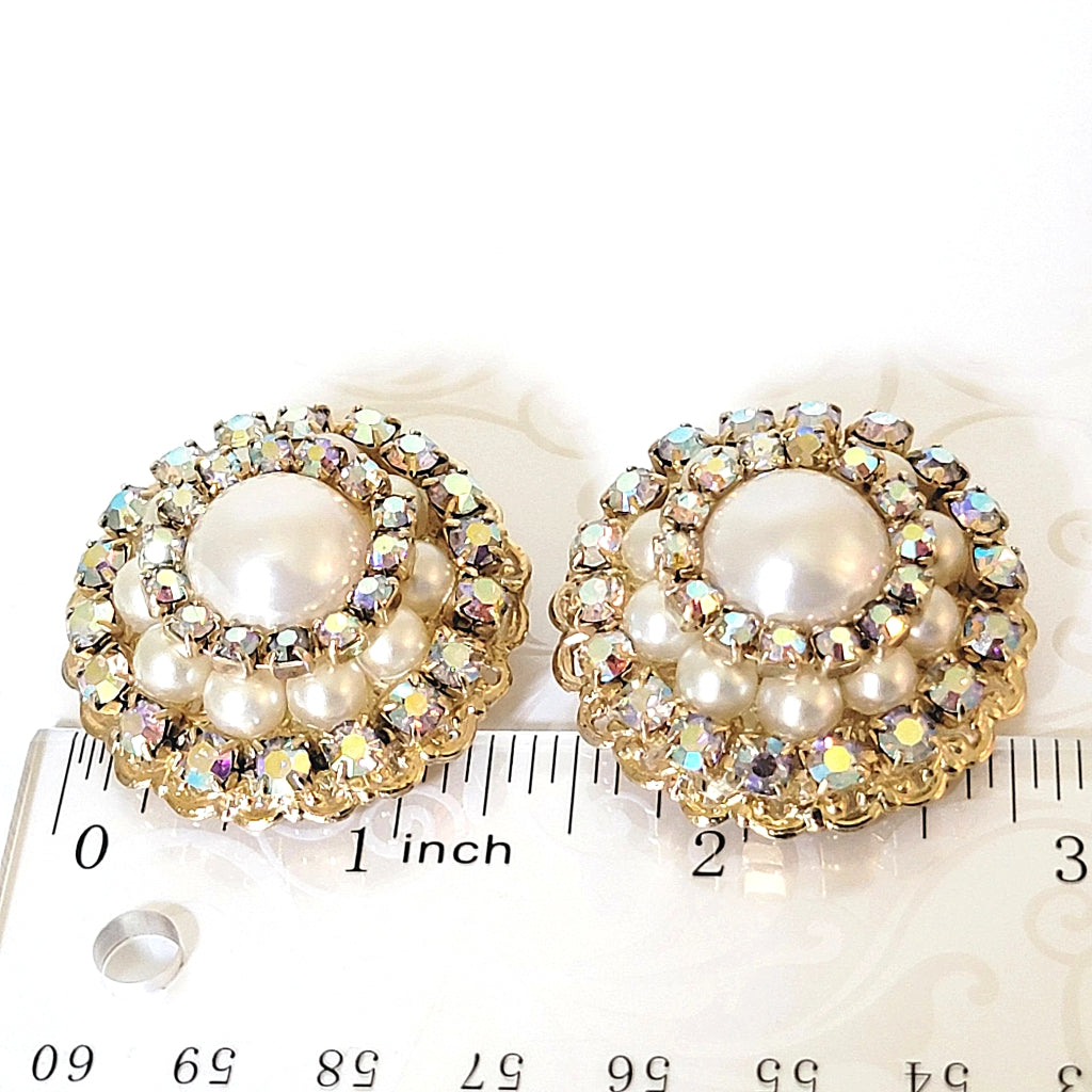 Rhinestone dome earrings with a ruler.