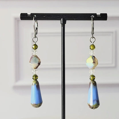 Long blue glass teardrop earrings.