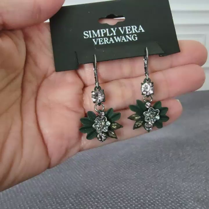 Simply Vera Wang earrings in hand.