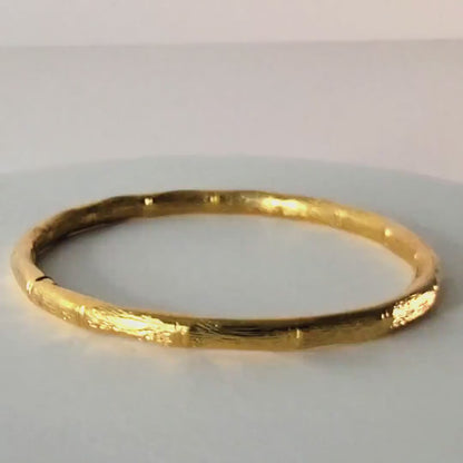 Vintage Monet gold tone bangle bracelet.